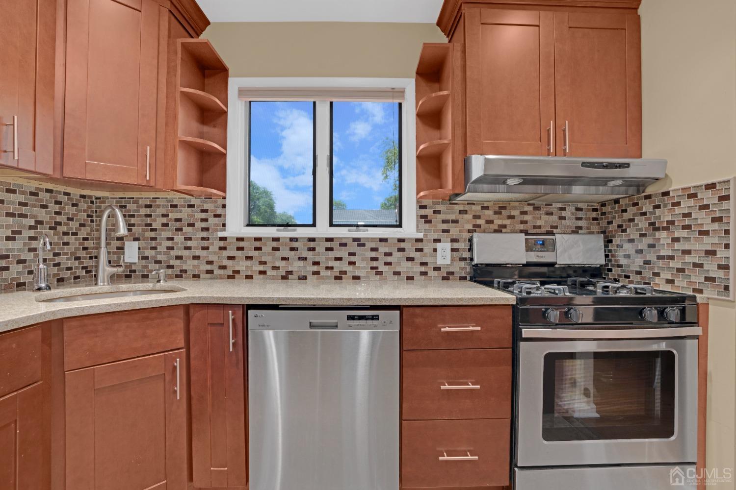 15 Brian Road Edison, NJ 08817 - Photo 10 of 19 a kitchen with stainless steel appliances granite countertop cabinets and stove top oven