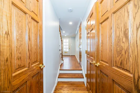 a kitchen with stainless steel appliances granite countertop a sink and a refrigerator