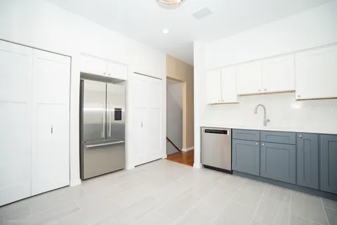 a view of an entryway with a kitchen