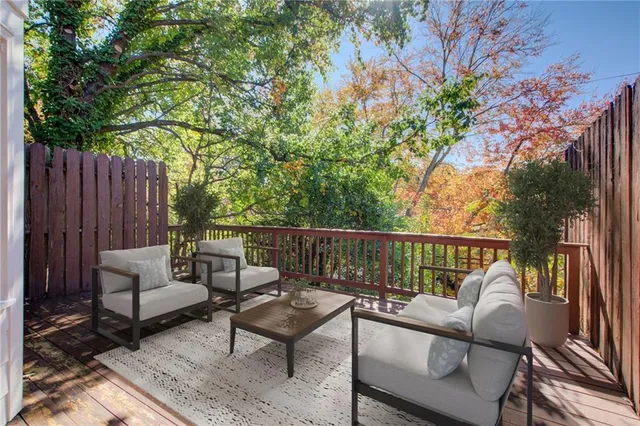 a view of sitting area with furniture on wooden deck