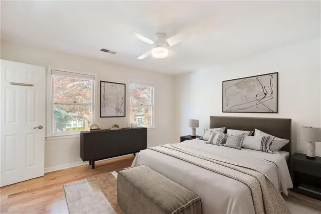 a bedroom with a large bed and a window