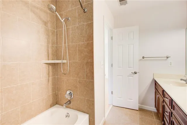 a view of a tennis ground with large trees