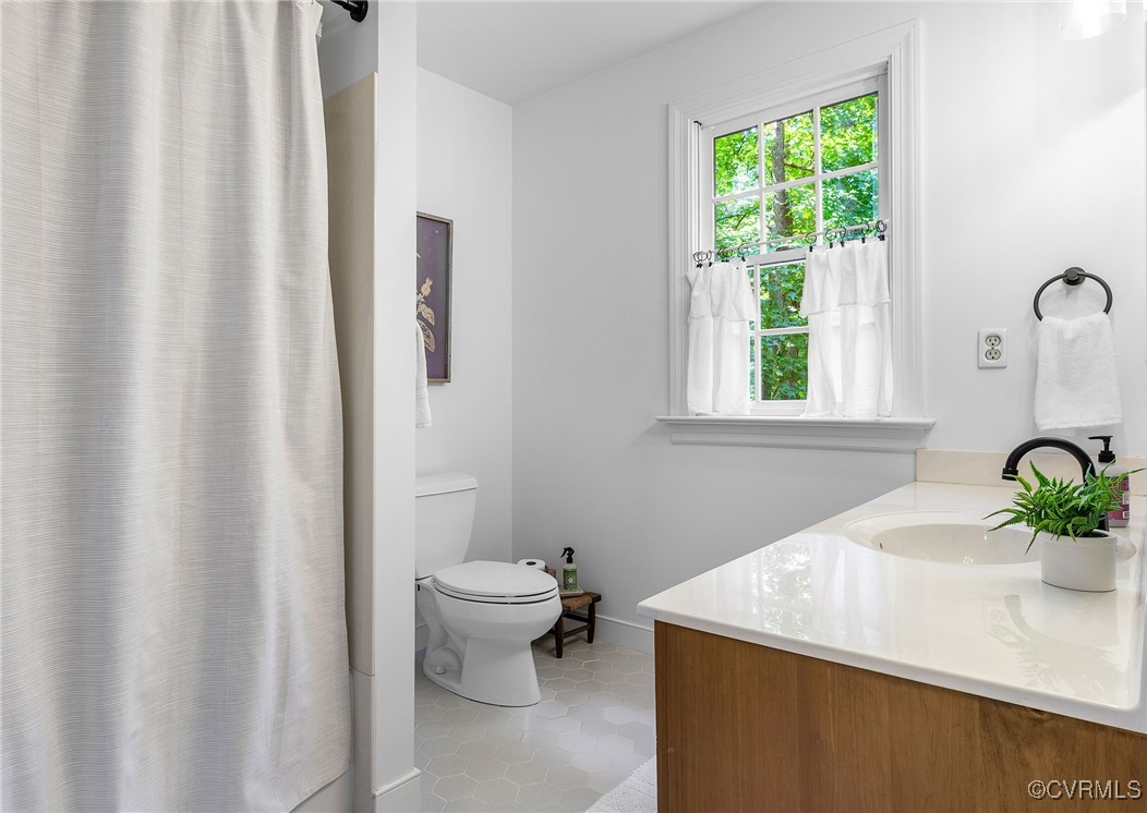 14471 West Salisbury Road Midlothian, VA 23113 - Photo 25 of 46 a bathroom with a sink toilet and window