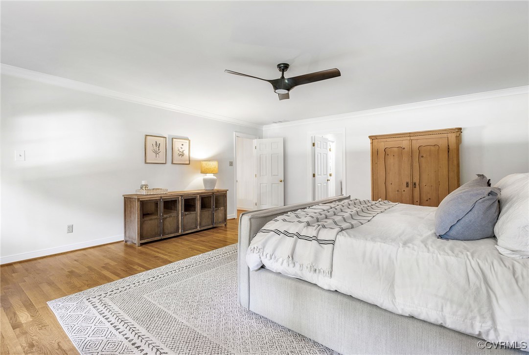 14471 West Salisbury Road Midlothian, VA 23113 - Photo 28 of 46 a bedroom with a bed and a chandelier