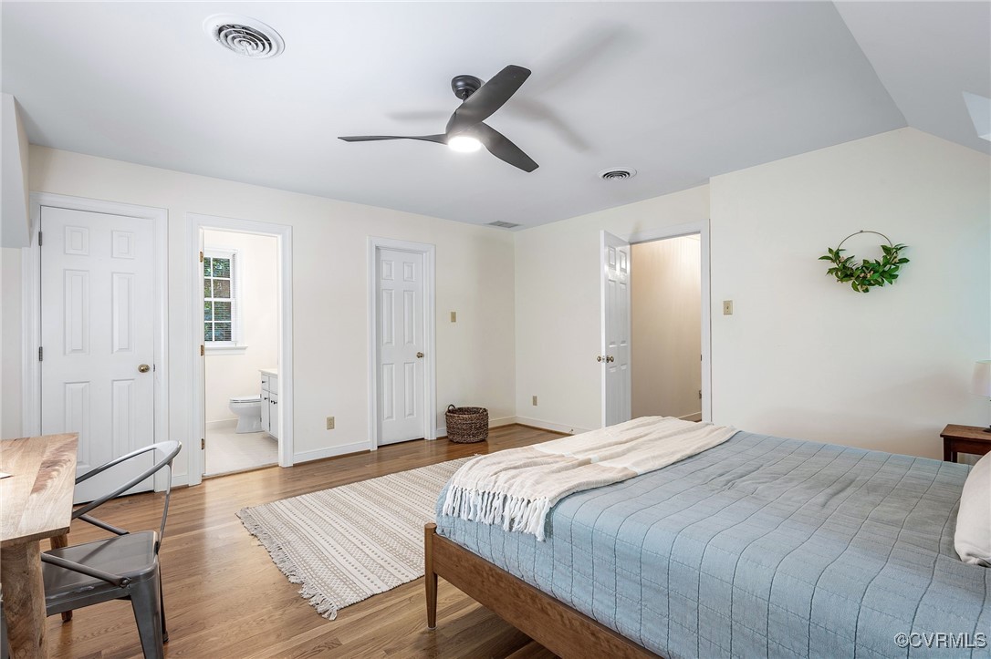 14471 West Salisbury Road Midlothian, VA 23113 - Photo 36 of 46 a bedroom with a bed and a potted plant