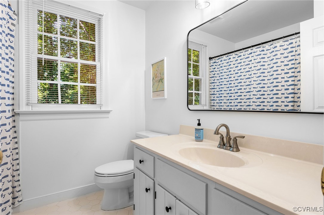 14471 West Salisbury Road Midlothian, VA 23113 - Photo 37 of 46 a bathroom with a sink a toilet and a mirror