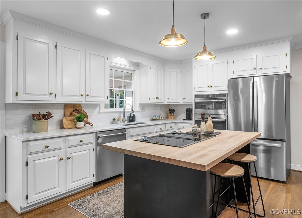 14471 West Salisbury Road Midlothian, VA 23113 - Photo 6 of 46 a kitchen with a white cabinets stove and refrigerator