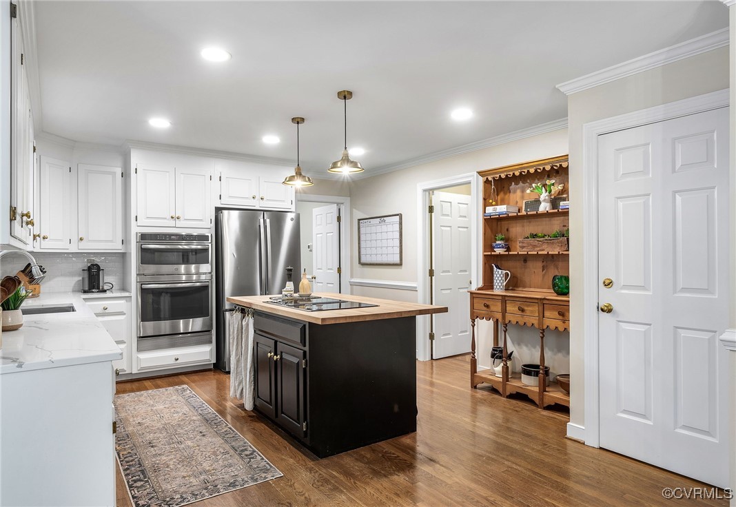 14471 West Salisbury Road Midlothian, VA 23113 - Photo 7 of 46 a kitchen with stainless steel appliances granite countertop a refrigerator and a stove top oven