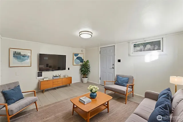 a bedroom with a bed and a large mirror