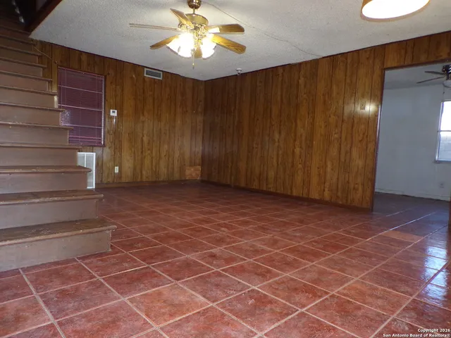 a kitchen with a refrigerator a stove top oven a sink and dishwasher