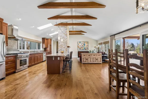 a living room with furniture and a kitchen