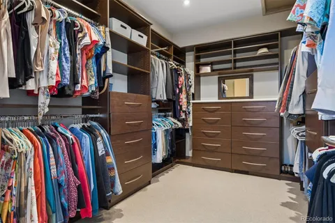 a room with gym equipment and a flat screen tv