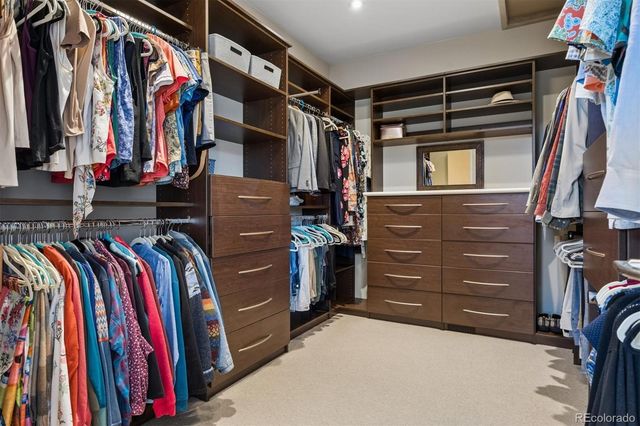 a room with gym equipment and a flat screen tv
