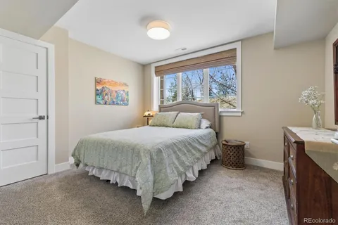 a bathroom with a toilet a sink a mirror and vanity