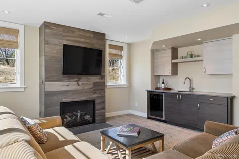 a view of a patio with a table chairs and backyard