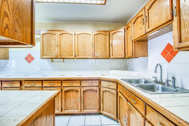 a view of a room with wooden floor and entryway
