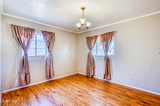 a view of a livingroom with a chandelier fan