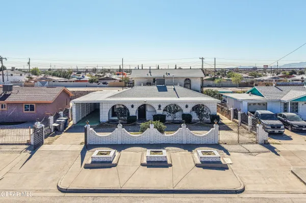 a roof deck with couches and a potted plant on it
