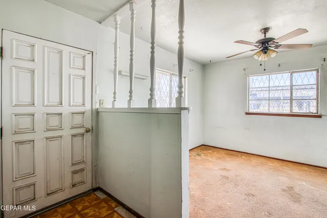 a view of a hallway with a window
