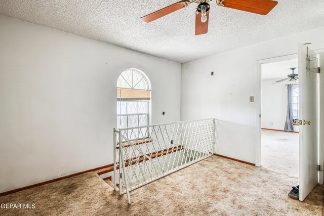 a view of a hall with stairs