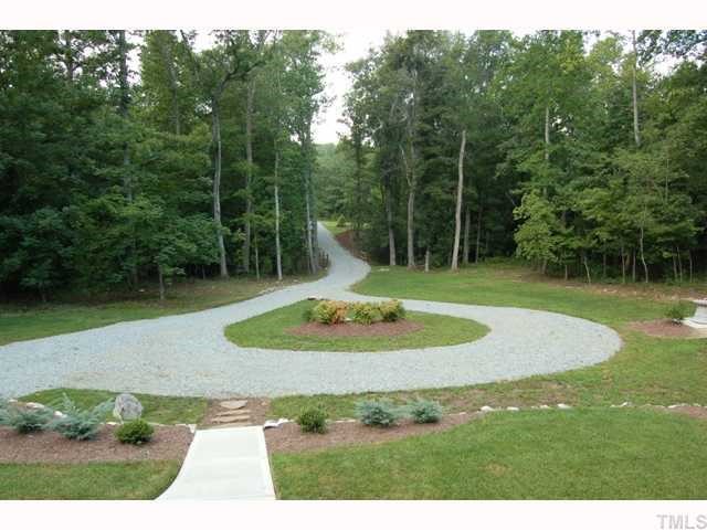 6912 Johnson Mill Road Bahama, NC 27503 - Photo 11 of 12 a view of a golf course with a fountain