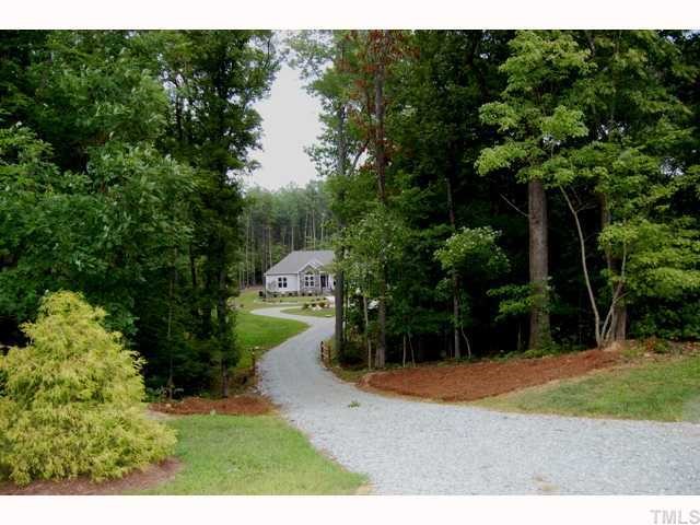 6912 Johnson Mill Road Bahama, NC 27503 - Photo 12 of 12 a backyard of a house with lots of green space