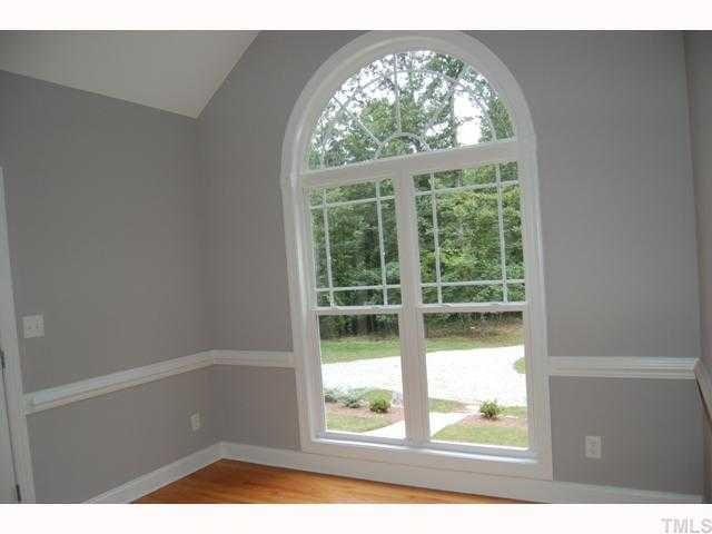 6912 Johnson Mill Road Bahama, NC 27503 - Photo 5 of 12 a view of an empty room with a window