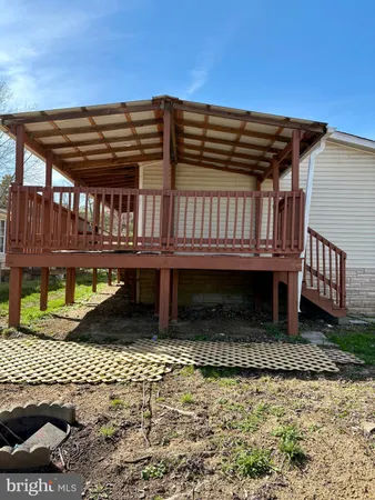 a view of a roof deck with wooden floor and fence