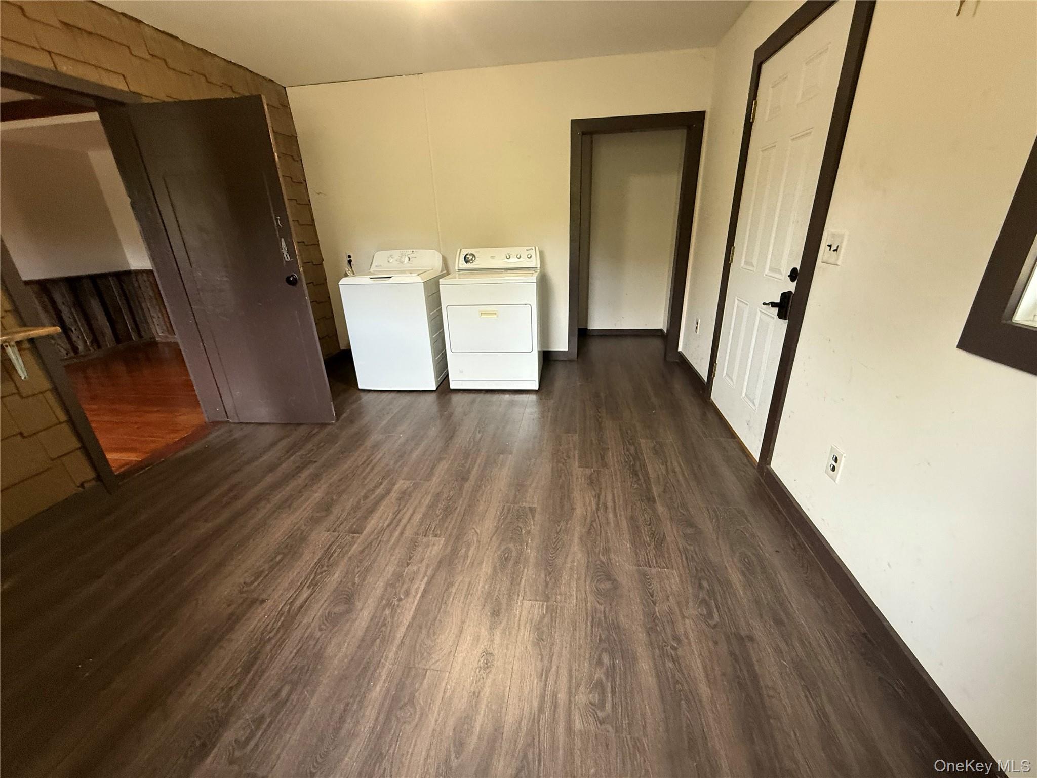241 White Bridge Road Middletown, NY 10940 - Photo 6 of 29 Washroom with dark wood-type flooring and washing machine and dryer
