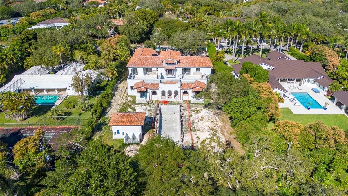 6460 Southwest 94th Street Pinecrest, FL 33156 - Photo 6 of 43 an aerial view of a house with a garden