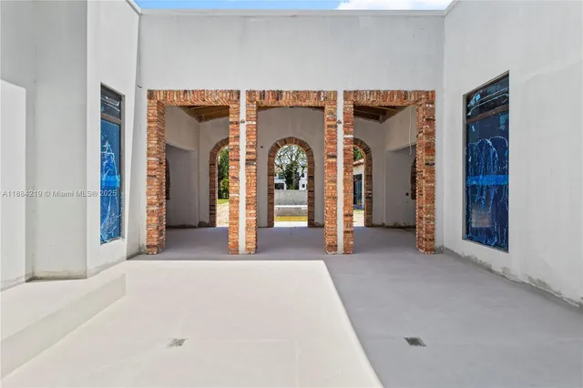 a view of a big room with mirror and closet