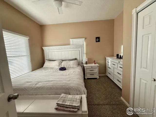 a bedroom with a bed and a couch