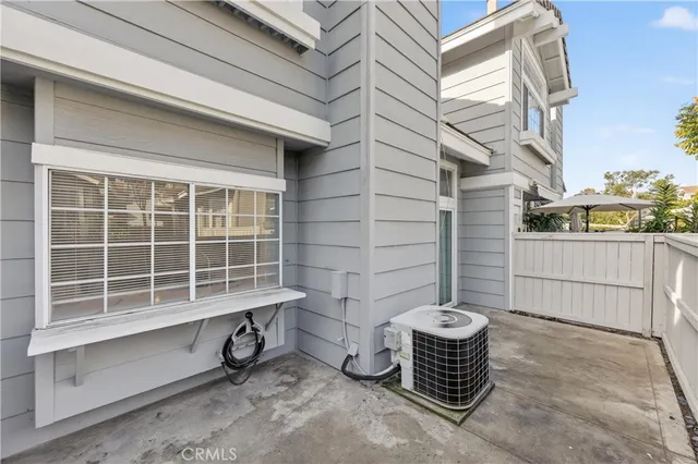 a view of a patio with table and chairs