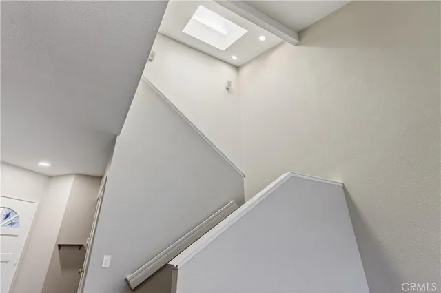 a view of a hallway with staircase