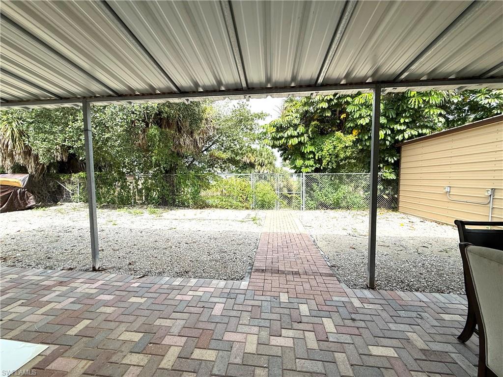 1964 42nd Street Southwest Naples, FL 34116 - Photo 21 of 25 a view of a backyard with plants