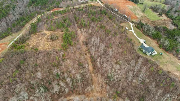 a view of a balcony with a yard
