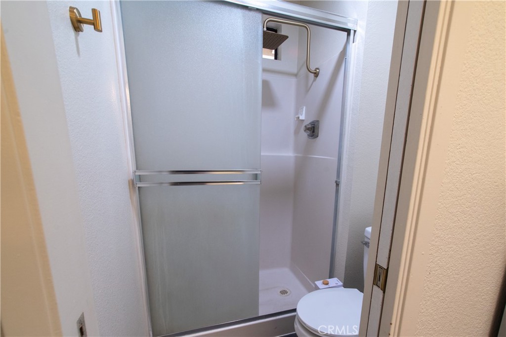 1 San Ramon Drive Chico, CA 95973 - Photo 28 of 42 a white toilet sitting next to a shower