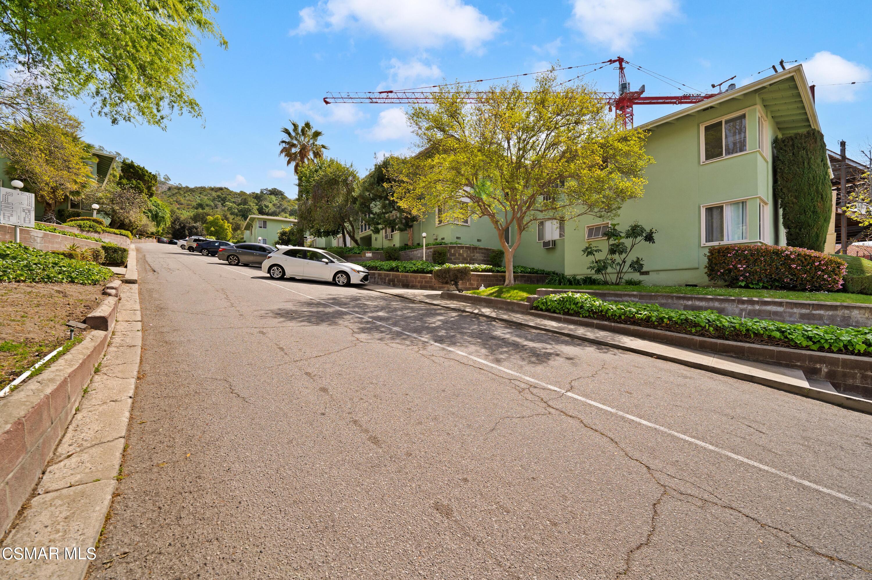 1550 North Verdugo Road Glendale, CA 91208 - Photo 16 of 61 a view of a house with a yard and potted plants
