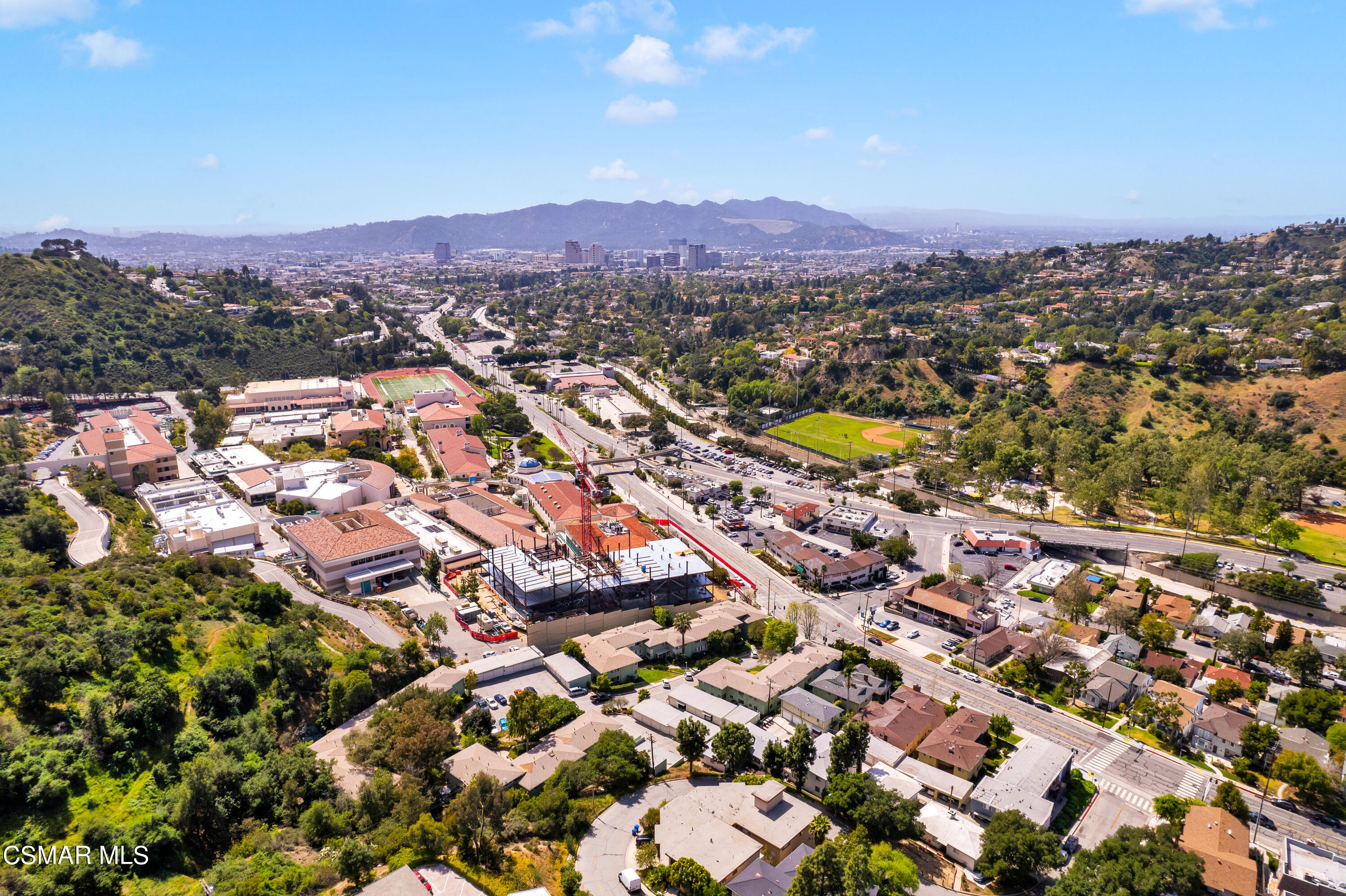1550 North Verdugo Road Glendale, CA 91208 - Photo 3 of 61 an aerial view of a city with lots of residential buildings and mountain view in back