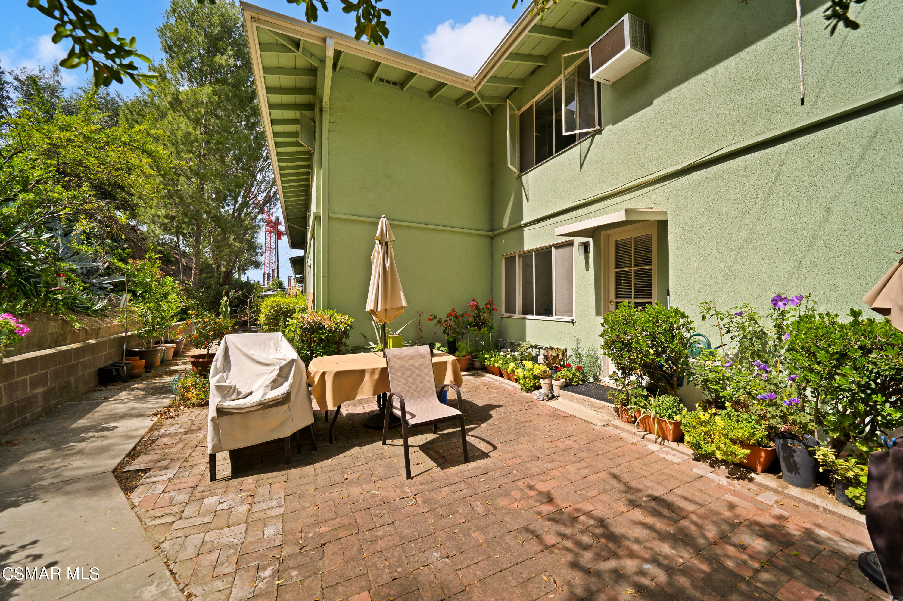 1550 North Verdugo Road Glendale, CA 91208 - Photo 32 of 61 a view of a patio with a table and chairs and potted plants