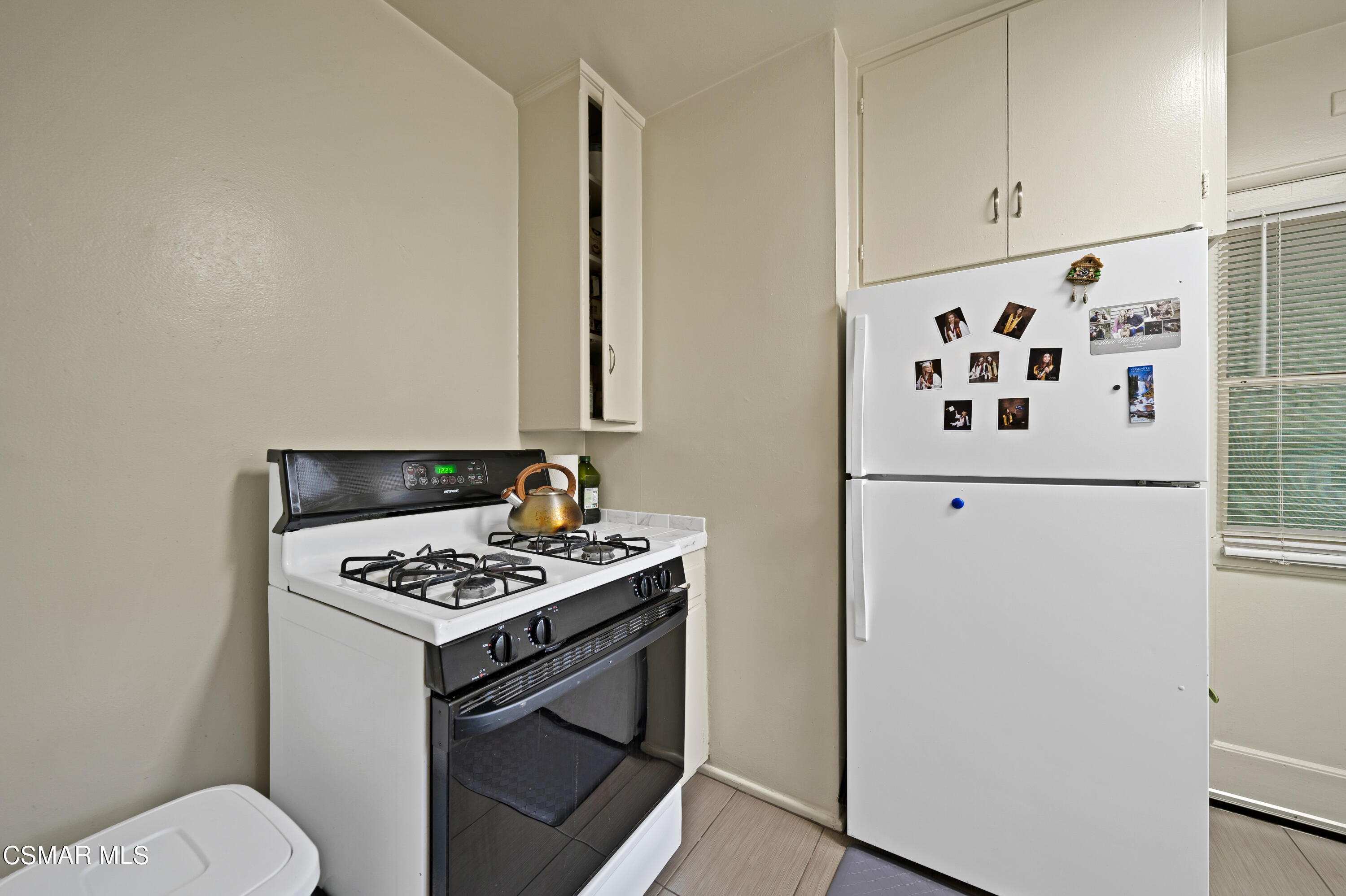 1550 North Verdugo Road Glendale, CA 91208 - Photo 45 of 61 a white kitchen with sink a stove and a refrigerator