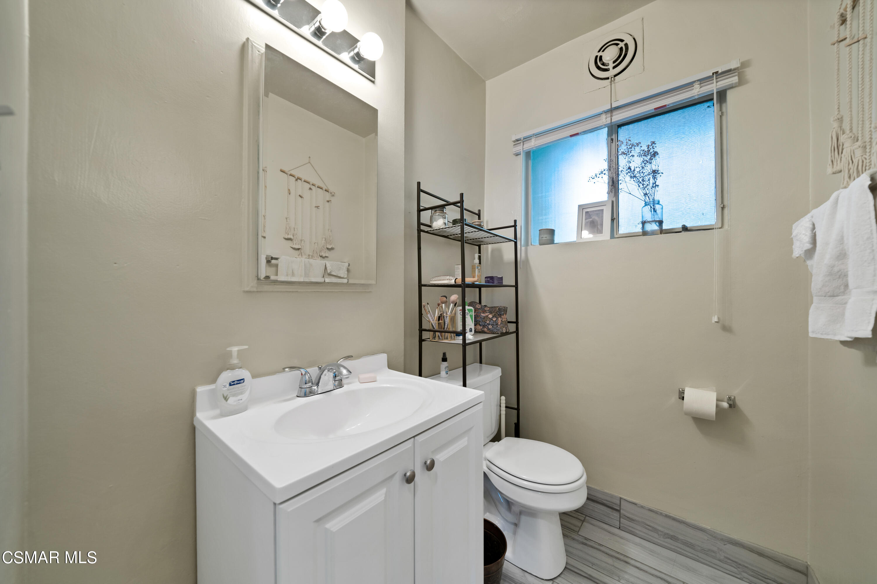 1550 North Verdugo Road Glendale, CA 91208 - Photo 46 of 61 a bathroom with a toilet a sink and mirror