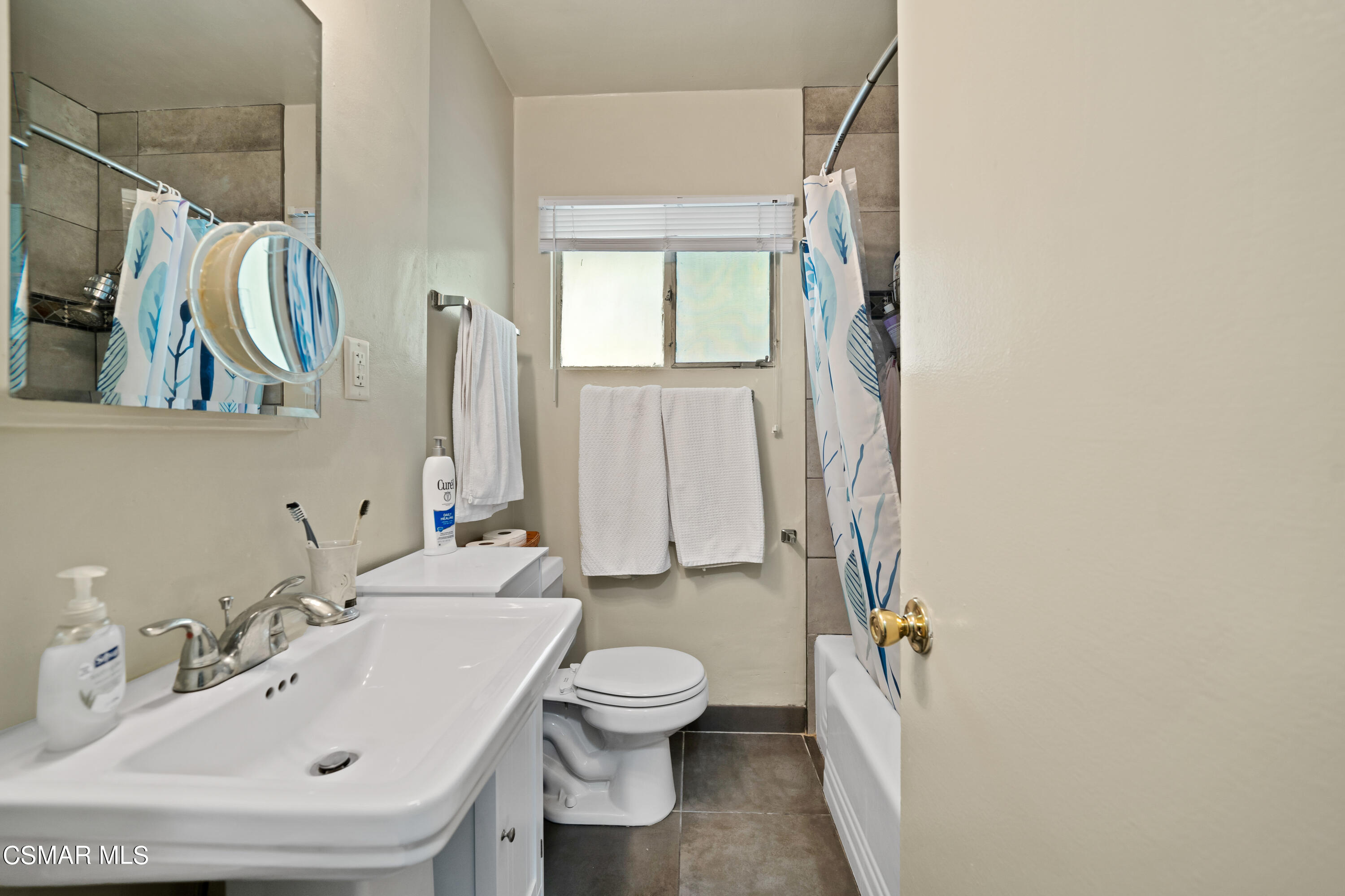 1550 North Verdugo Road Glendale, CA 91208 - Photo 48 of 61 a bathroom with a sink a toilet and a mirror