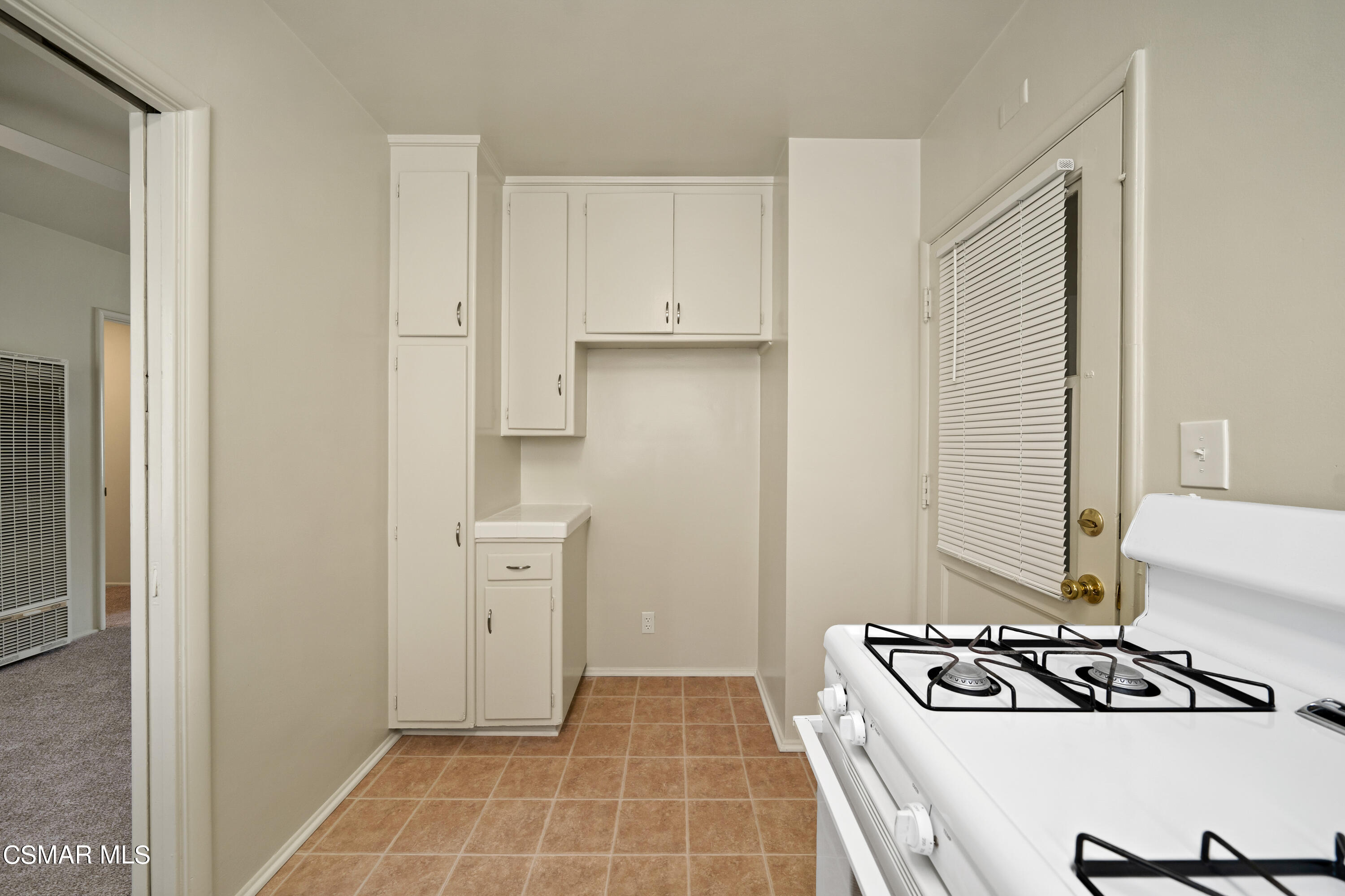1550 North Verdugo Road Glendale, CA 91208 - Photo 57 of 61 a kitchen with white cabinets and a stove