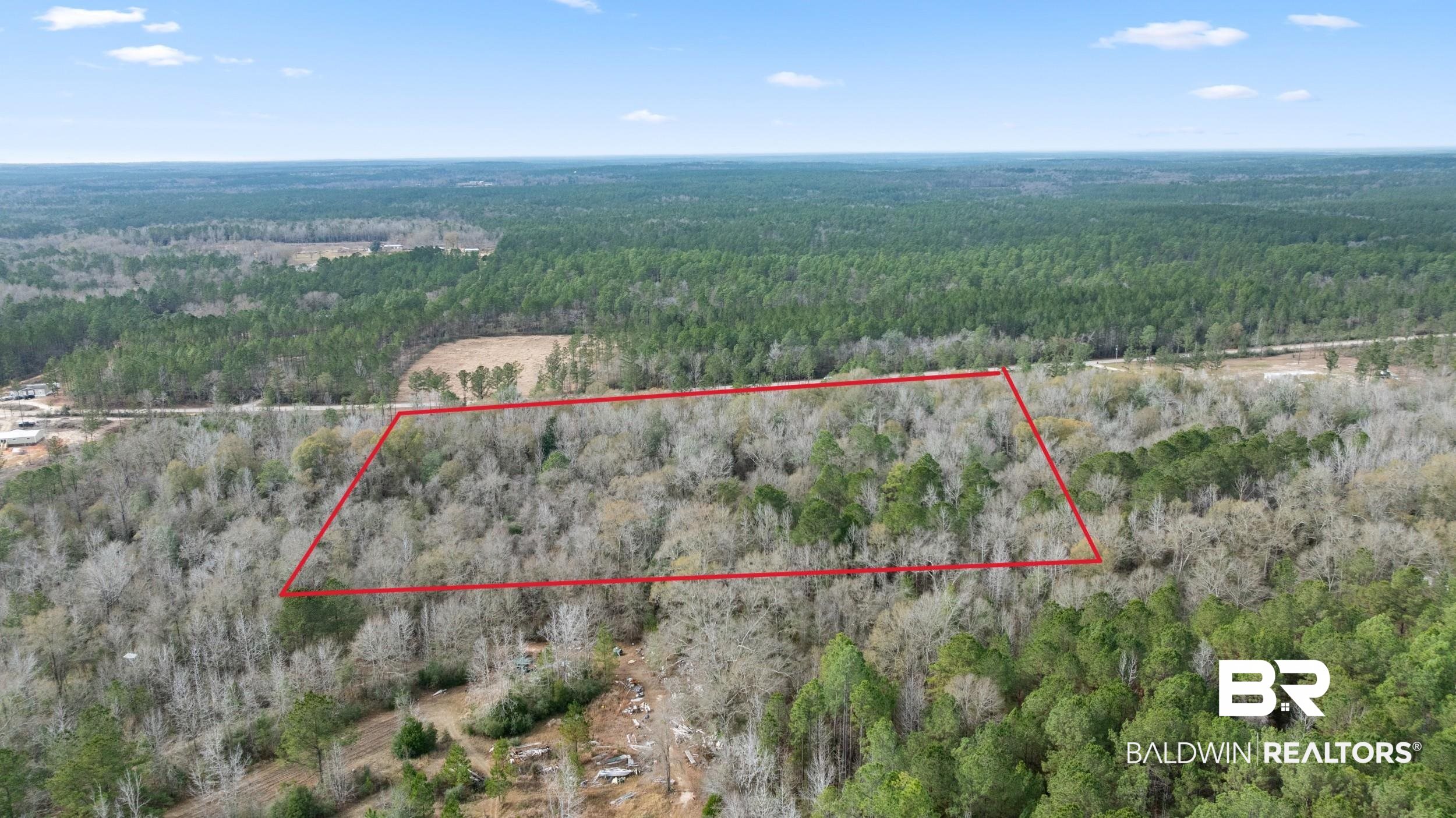 0 Lottie Road Atmore, AL 36502 - Photo 4 of 17 Aerial view of property's location with a forest and property parcel outlined