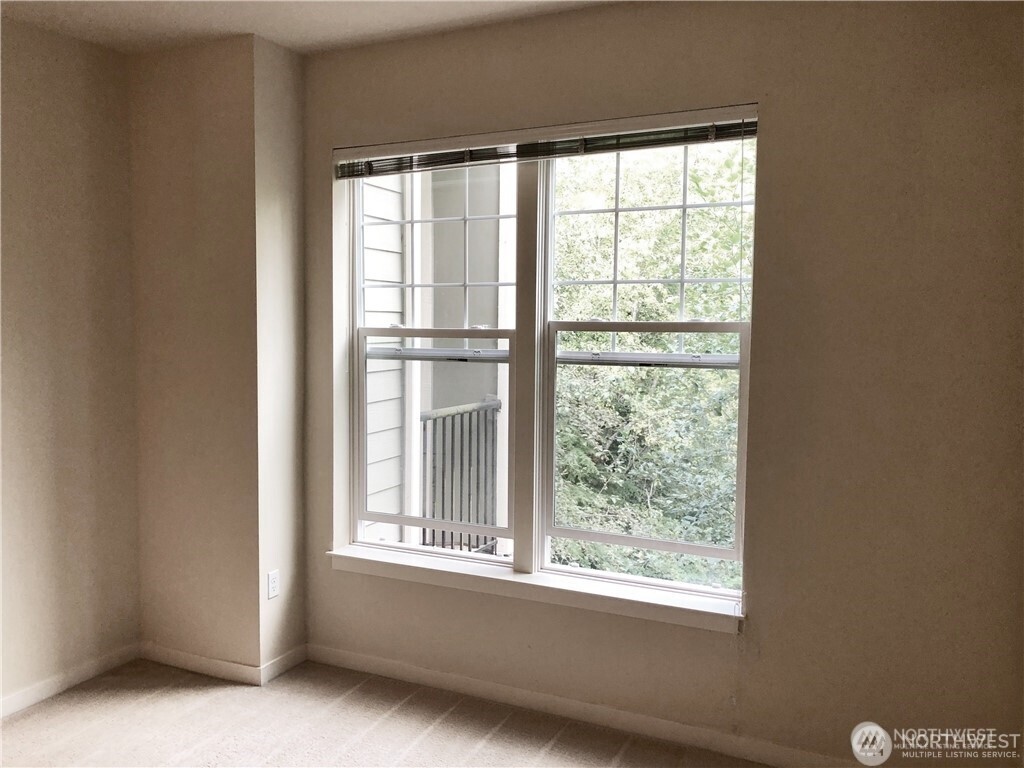 4321 Issaquah-Pine Lake Road Southeast, Unit 408 Sammamish, WA 98075 - Photo 13 of 33 a view of an empty room with a window