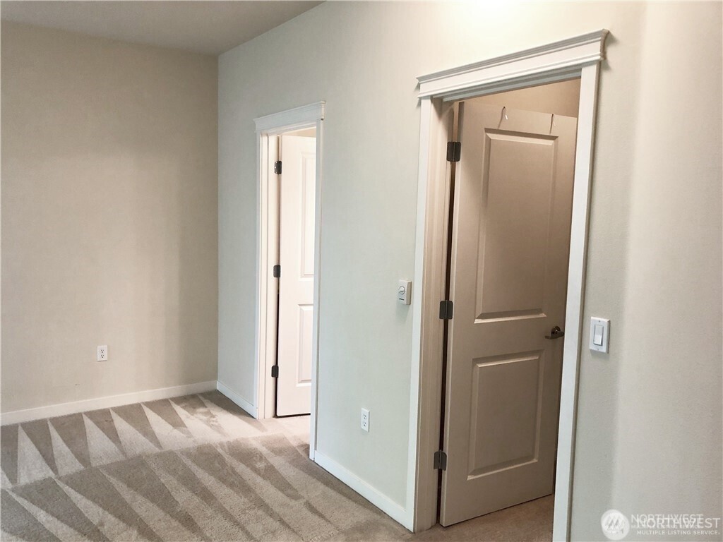 4321 Issaquah-Pine Lake Road Southeast, Unit 408 Sammamish, WA 98075 - Photo 16 of 33 a view of a hallway with wooden floor