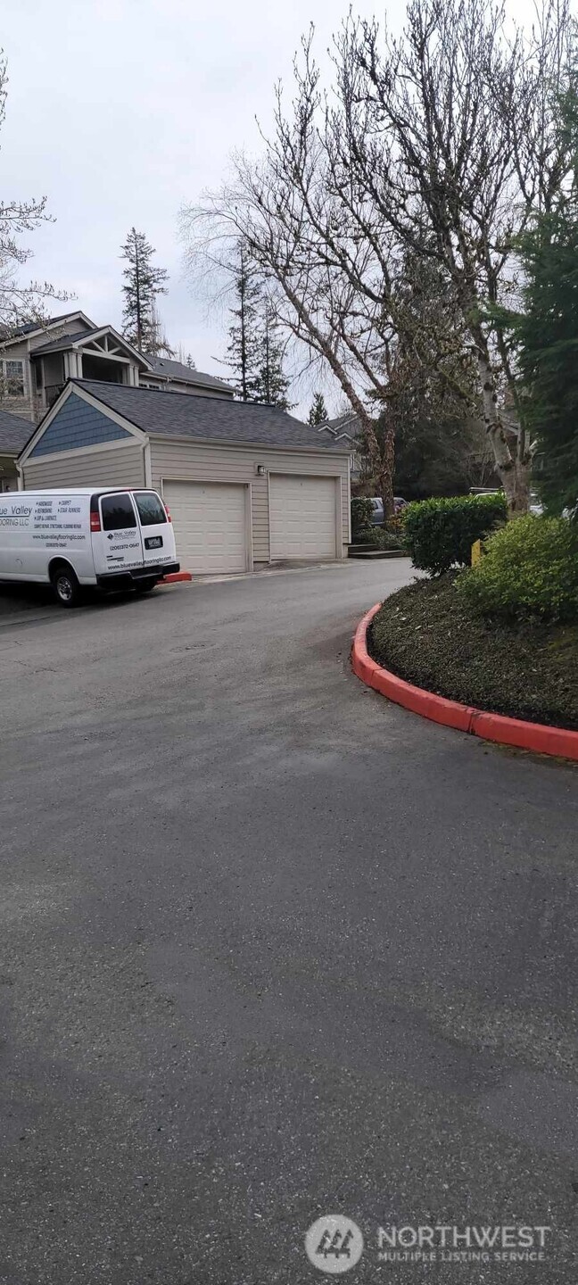 4321 Issaquah-Pine Lake Road Southeast, Unit 408 Sammamish, WA 98075 - Photo 29 of 33 a car parked on the side of the road