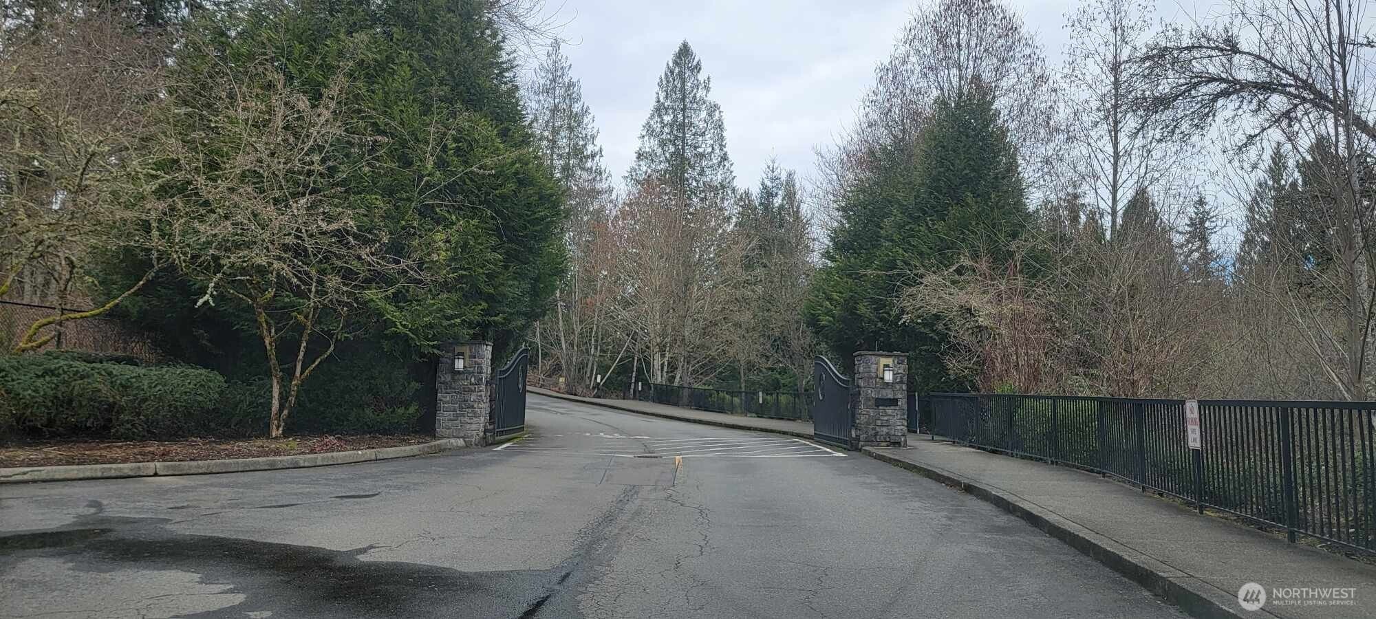 4321 Issaquah-Pine Lake Road Southeast, Unit 408 Sammamish, WA 98075 - Photo 32 of 33 a view of a street with a trees in the background