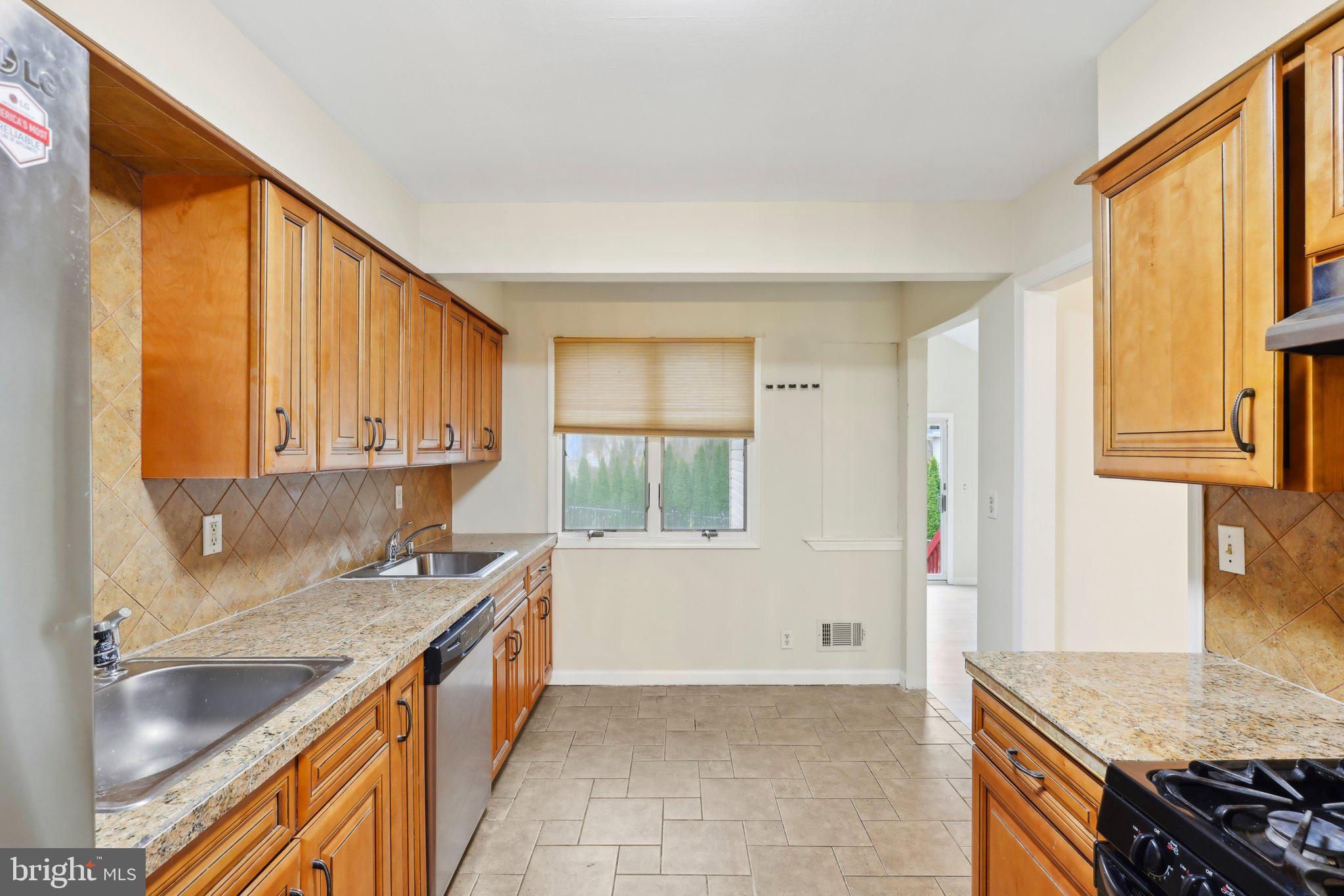 117 Susan Drive Jackson, NJ 08527 - Photo 12 of 43 a kitchen with a sink stove and cabinets